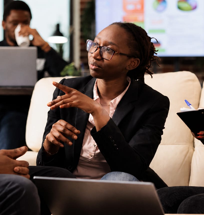 A Hagios Advisory consultant in discussion with a client